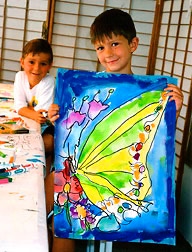 Jeffrey Shutt Age 6 holding original watercolor Butterfly